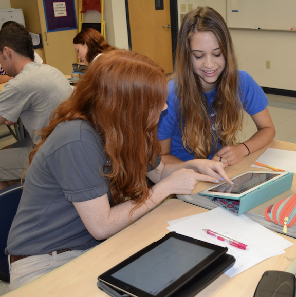 Two students working on an iPad