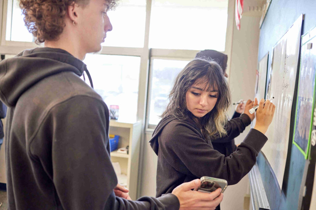 2 students at the whiteboard