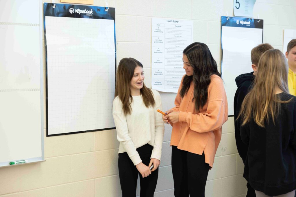 Two students interacting in front of VNPS