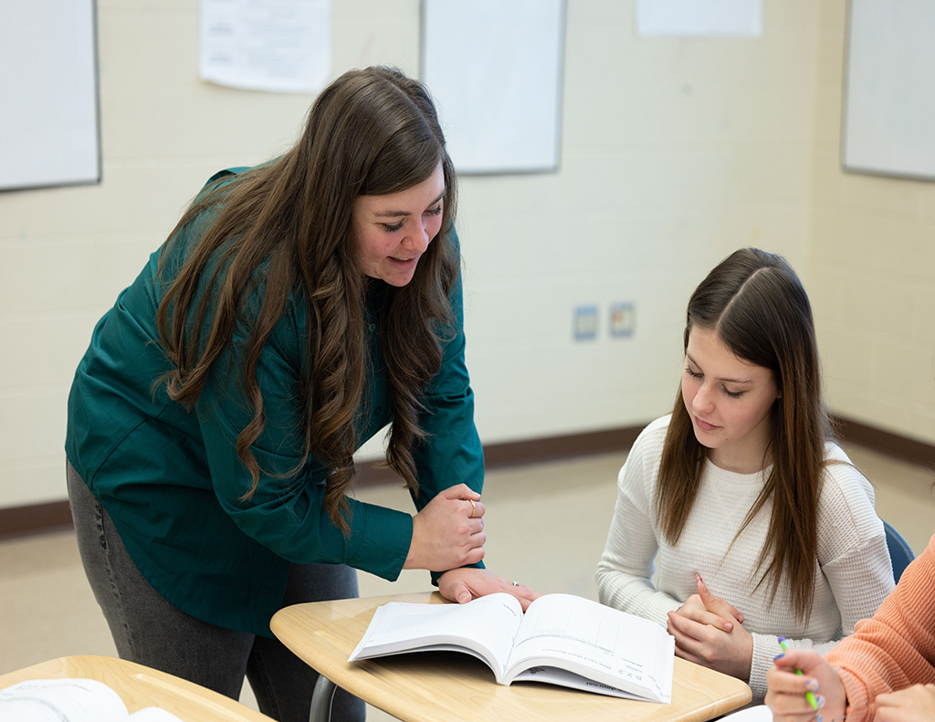 teacher helping student