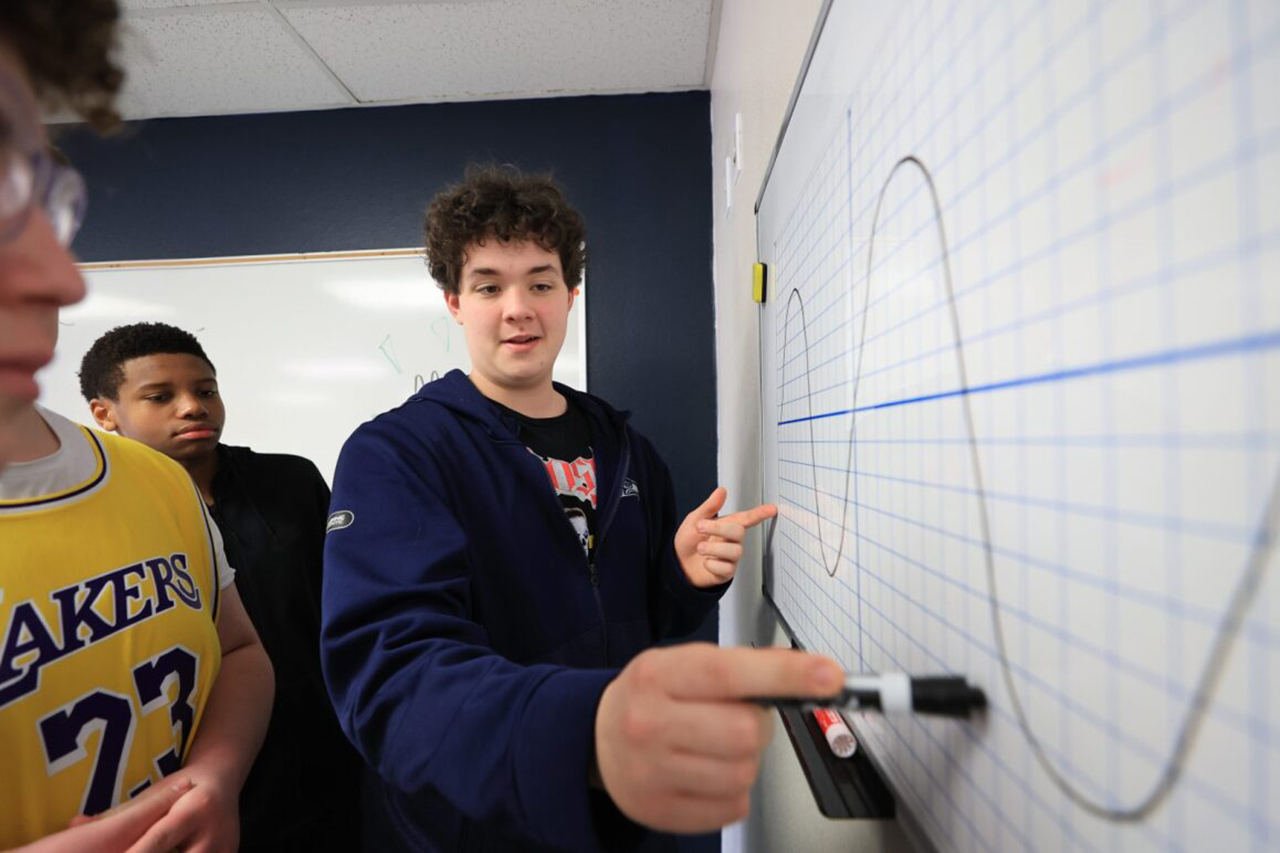 Students collaborating on a math problem