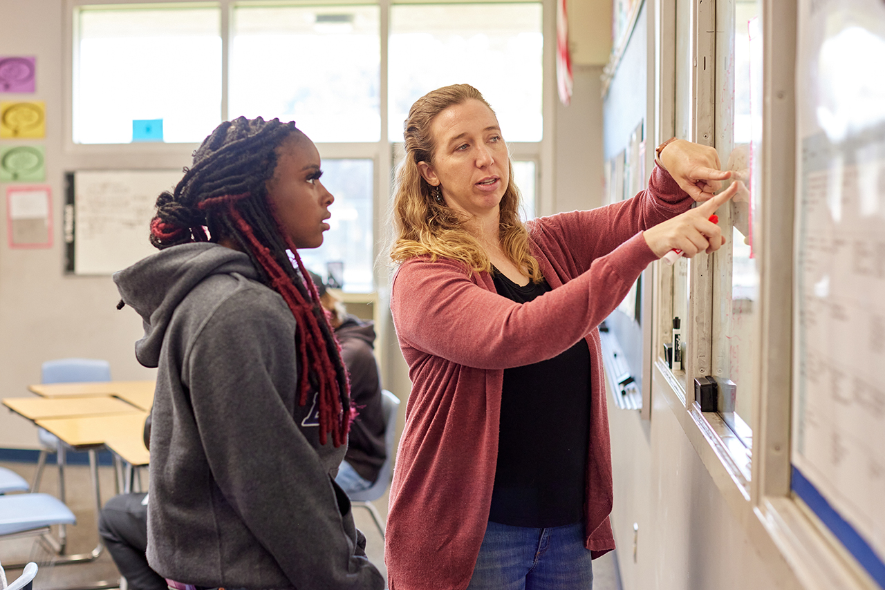 High school students working collaboratively on math