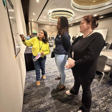 Teachers talking during a session at the 2026 CPM Teacher Conference