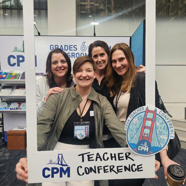 Teachers smiling together at the 2026 CPM Teacher Conference