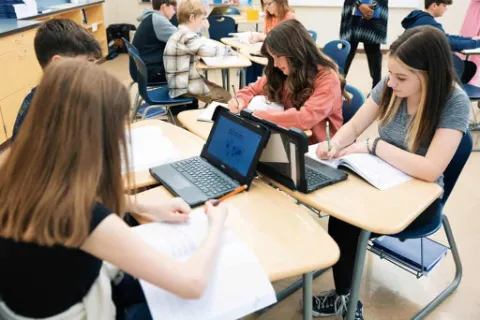 Student working at a whiteboard