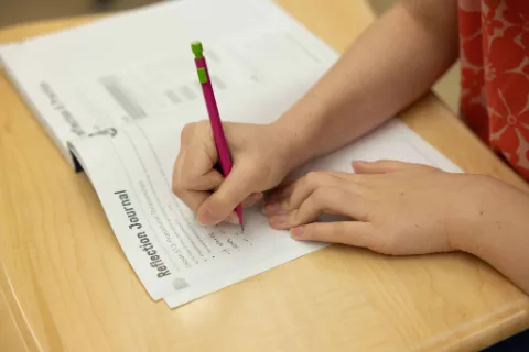 Students collaborating at desks